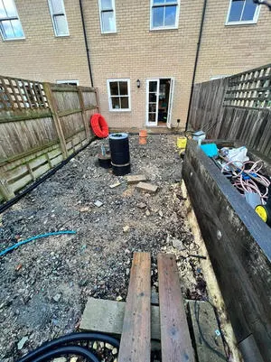Garden mid-preparation before new paving is laid