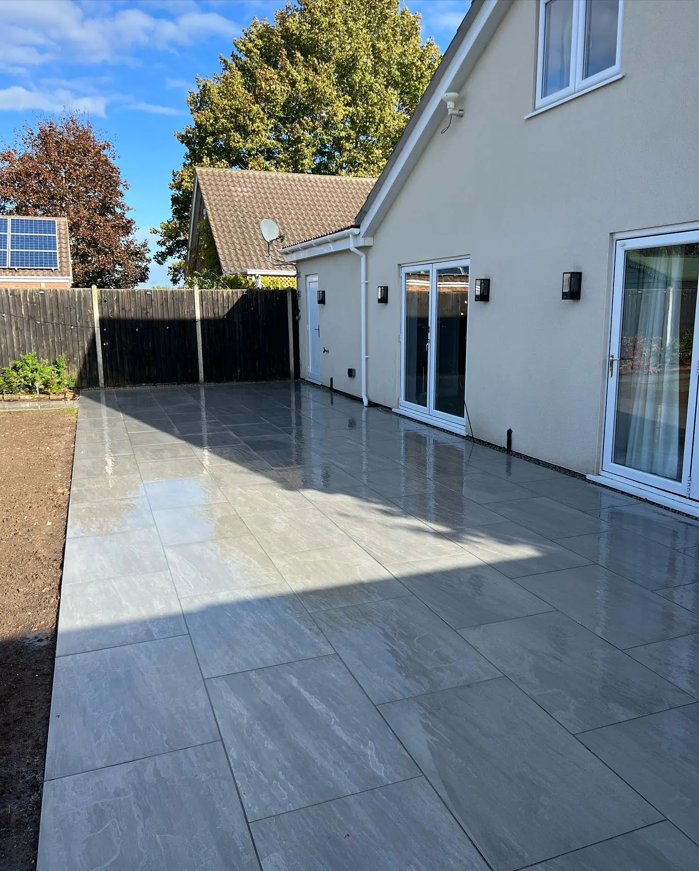 Grey porcelain patio laid by JDS Landscaping at a home in Suffolk